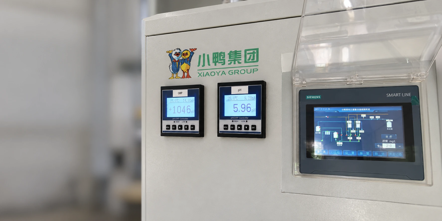 AI-adapted detail based on a Xiaoya control-panel photo, showing the equipment logo, ORP and pH meters, and protected touchscreen